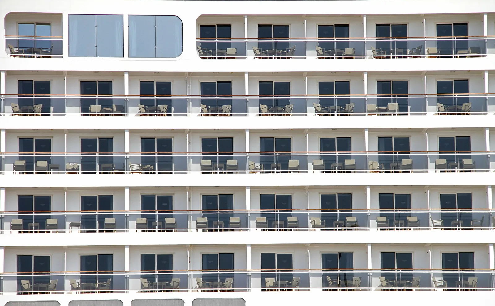 Cabin balconies on the side of a cruise ship, the cabin an offer books