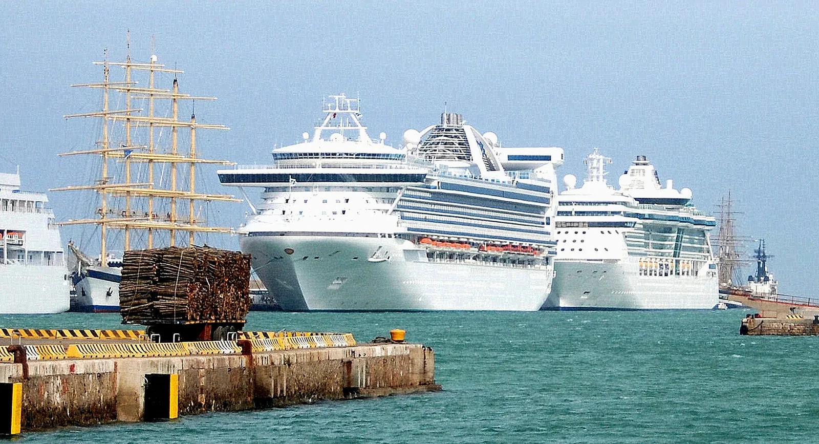 Cruise ships side by side at one pier, one cruise after another from the same port