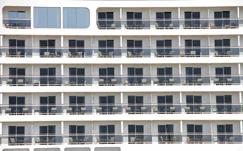Rows of balcony cabins on the side of a cruise ship, the cabin you book with a casino offer