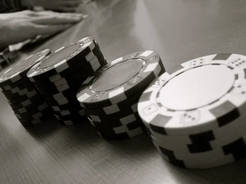 Stacks of casino chips, one stack taller than the next, for the four Club Royale tiers